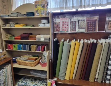 Shelves of wool fabrics and precuts